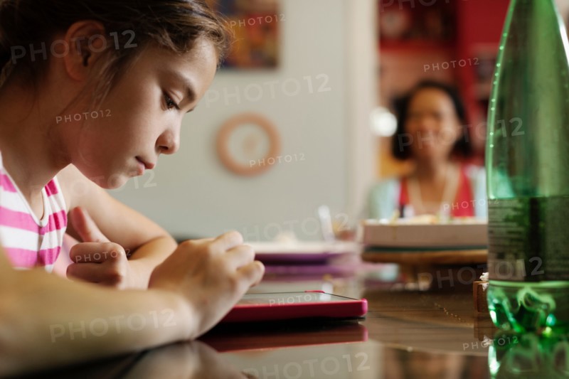 Girl using digital tablet