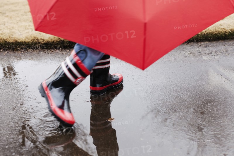 Wellingtons and umbrella