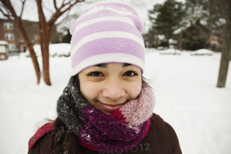 Portrait of teenage girl wrapped up for winter snow