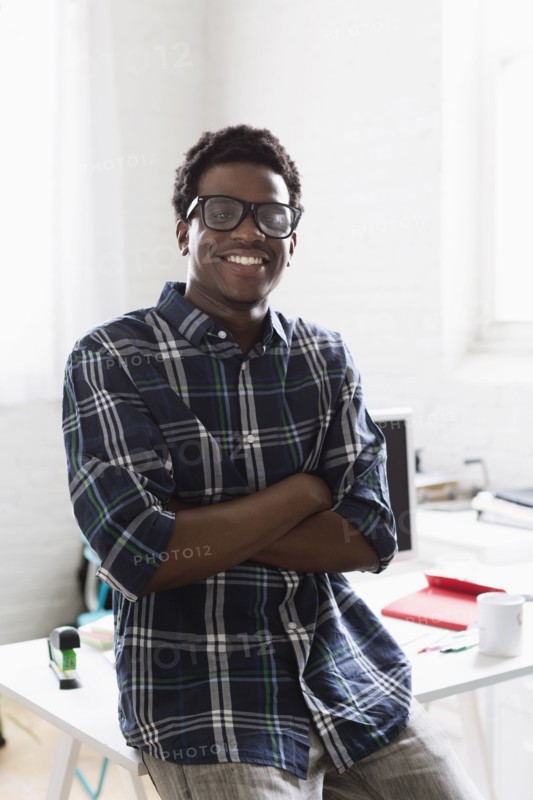 Portrait of young man wearing checked shirt