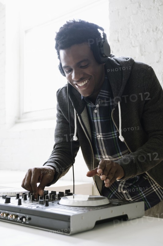DJ using mixing desk