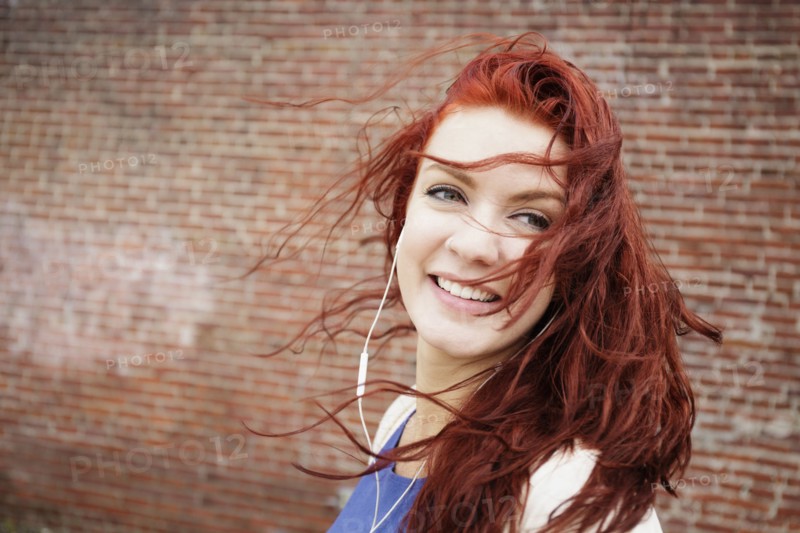 Young woman with long red hair