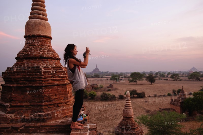 Woman taking photograph of view