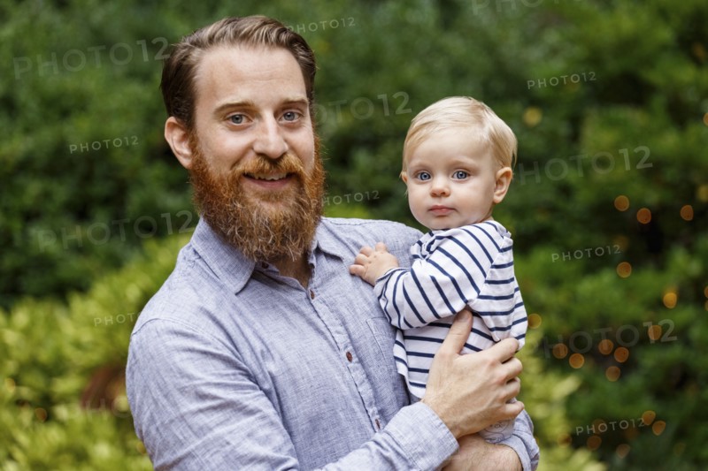 Portrait of father holding baby girl