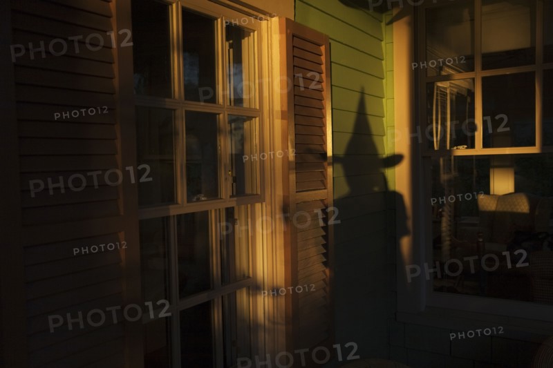 Shadow of witch on house