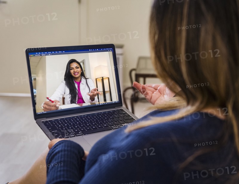 Woman having video call with doctor