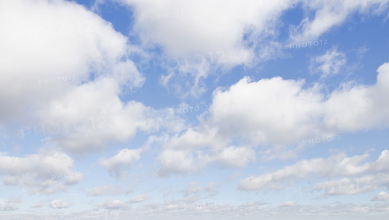 White cumulus clouds on sky