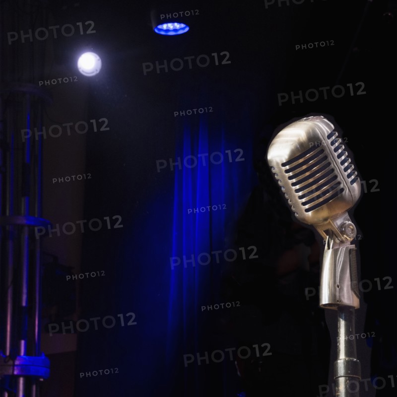 Old fashioned microphone on empty stage
