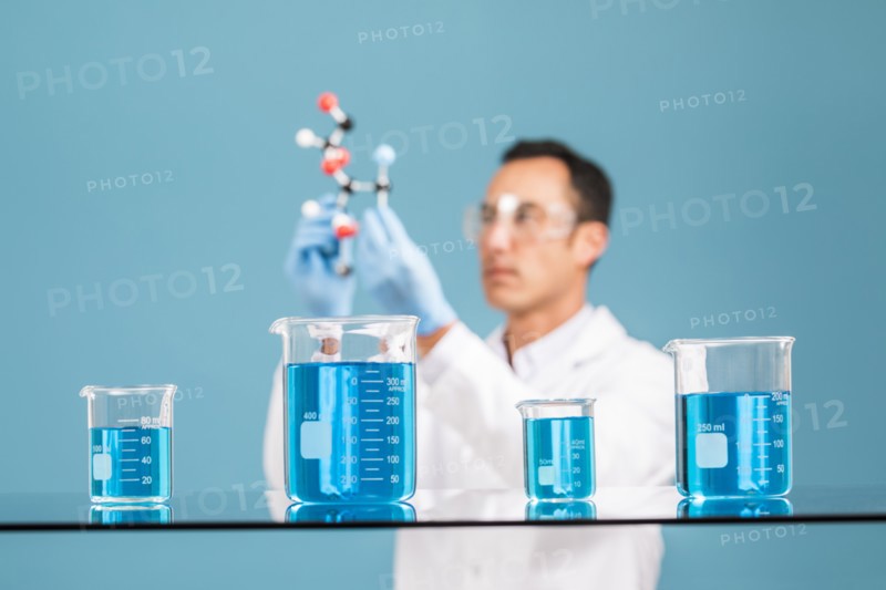 Scientist holding molecule model