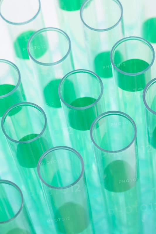 Close-up of test tubes with green liquid