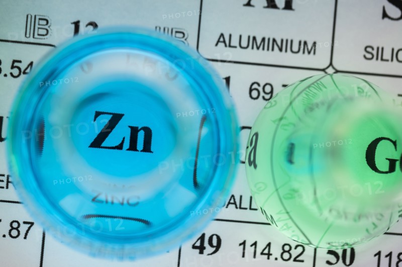 Laboratory glassware with liquids on periodic table