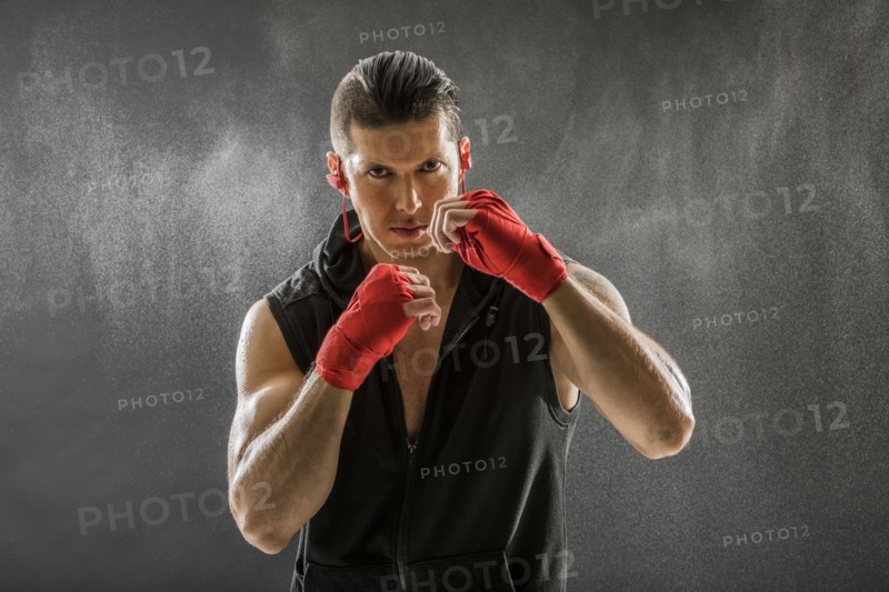 Portrait of muscular man in boxing stance