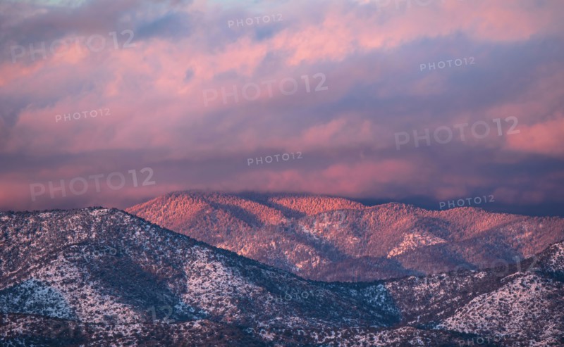 Colorful clouds at sunset over Sangre de Cristo Mountains