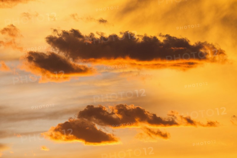 Silhouettes of cloud son sunset sky