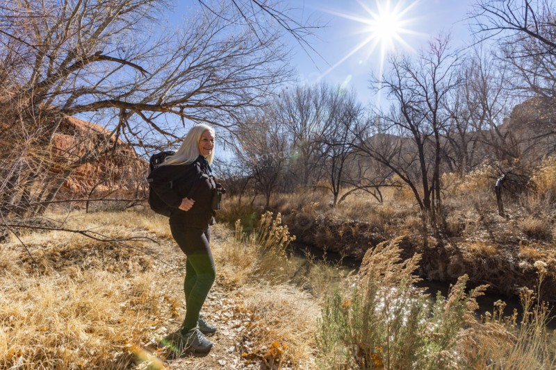 Woman hiking along Escalante River in Grand Staircase-Escalante National Monument