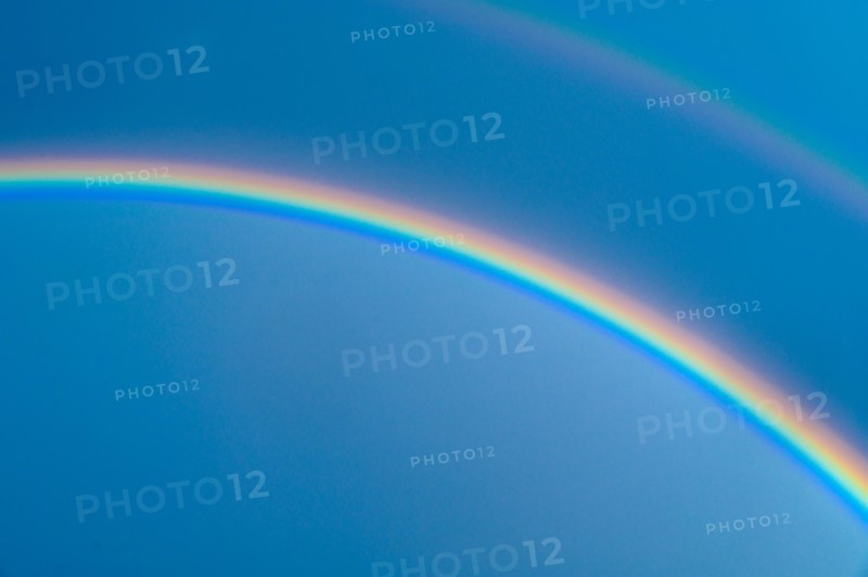 Double rainbow on blue sky