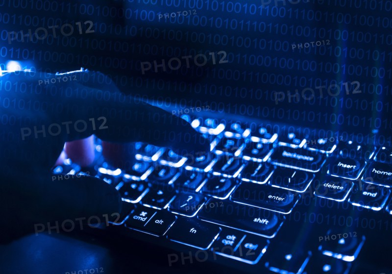 Fingers at computer keyboard