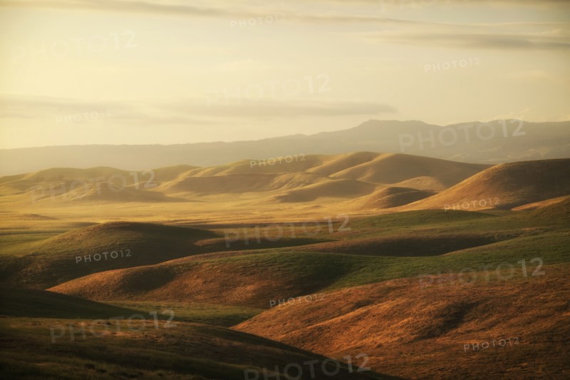Hilly landscape at sunset