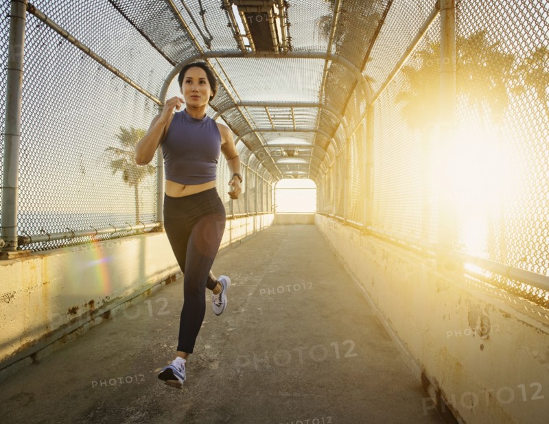 Woman jogging at sunset