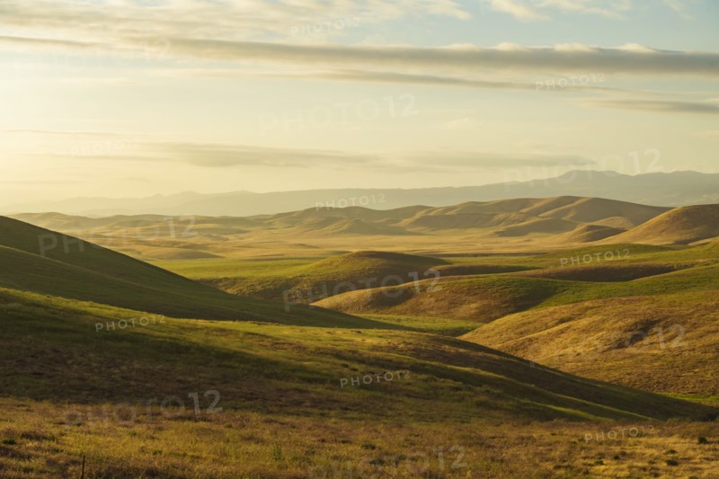 Hilly landscape at sunset