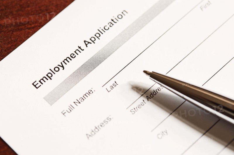 Job application form and pen