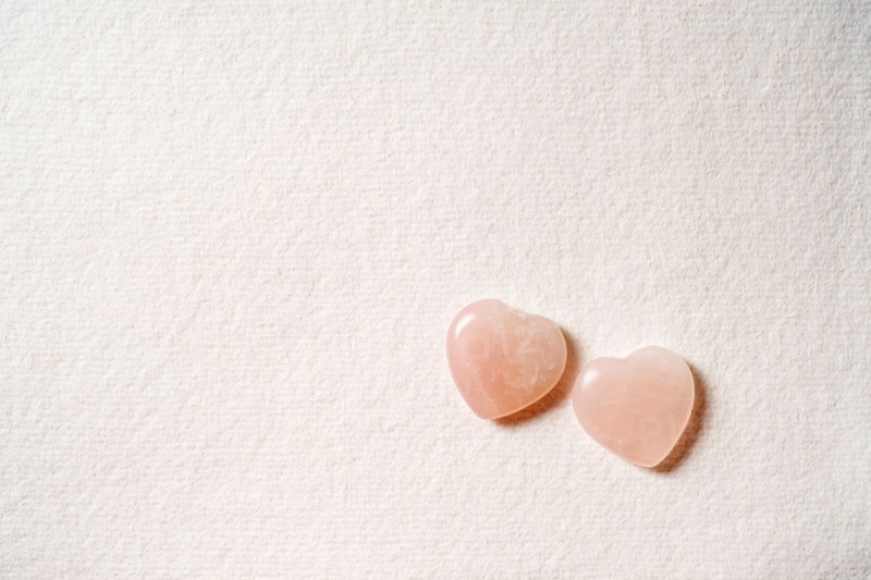 Glass hearts on white background
