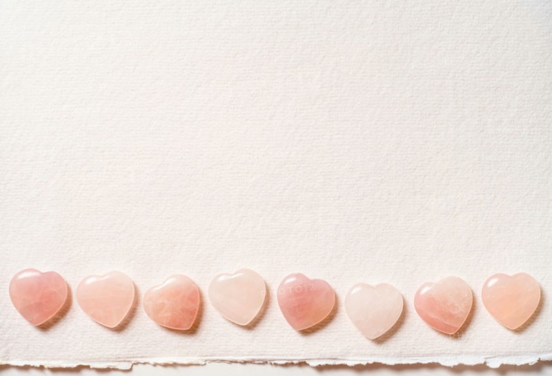 Glass hearts on white background