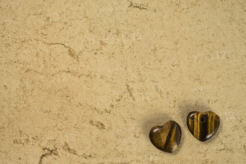 Wooden hearts on beige background