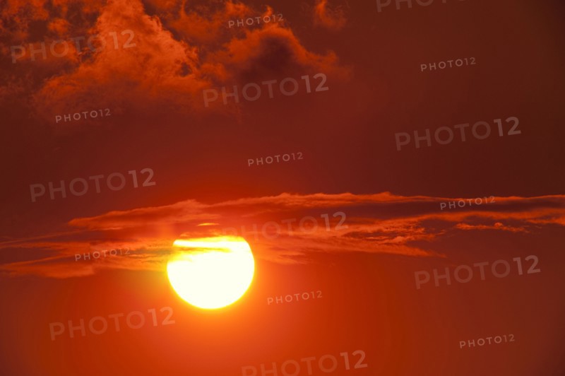 Setting sun among clouds