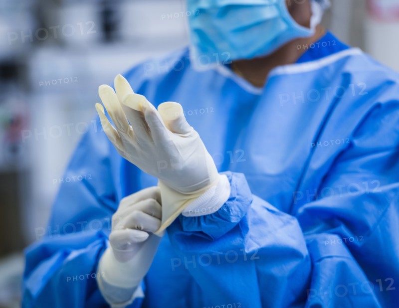Female doctor preparing for surgery in operating theater