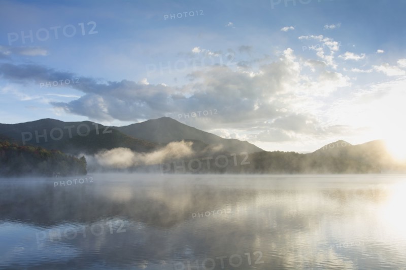 Usa, New York, Whiteface Mountain reflecting in Placid Lake