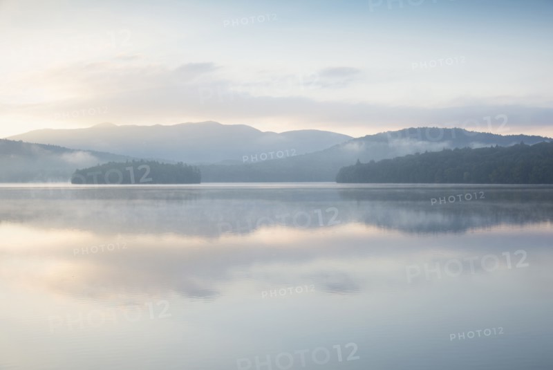 Usa, New York State, North Elba, Morning fog over Placid Lake