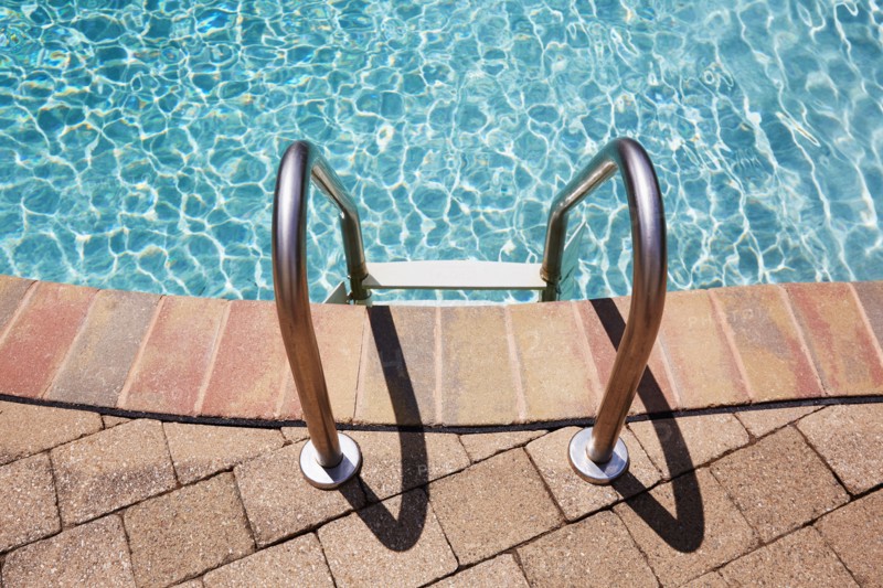 Ladder on swimming pool edge