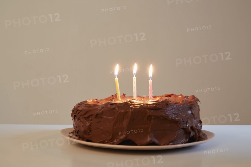 Candles in chocolate birthday cake