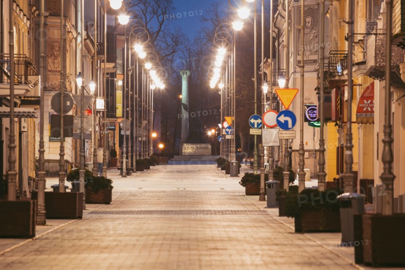 Poland, Holy Cross, Kielce, City street illuminated at night
