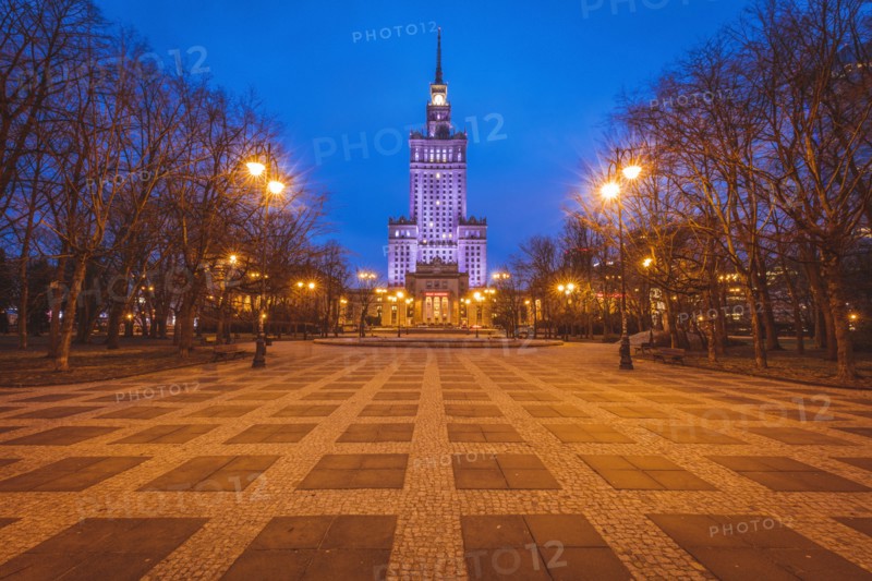 Poland, Masovia, Warsaw, Illuminated high rise building at town square