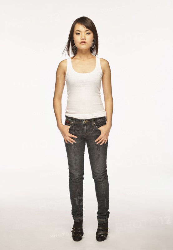 Studio portrait of woman in white tank top