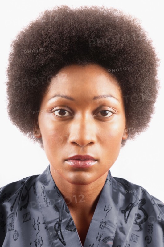 Studio portrait of woman with afro hair