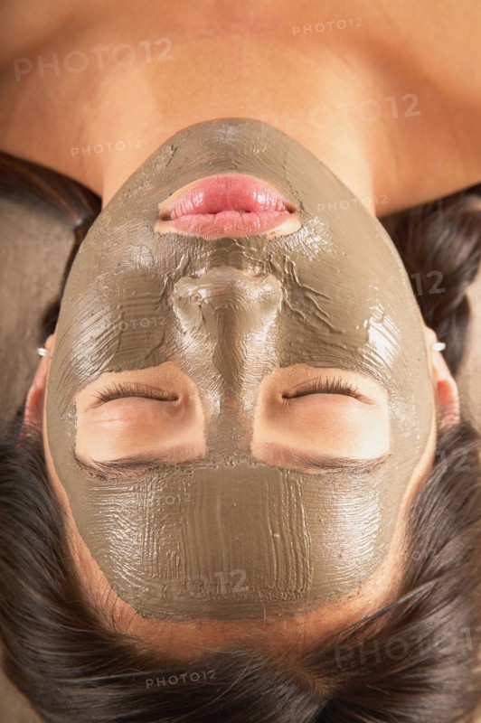 Close-up of woman with facial mask