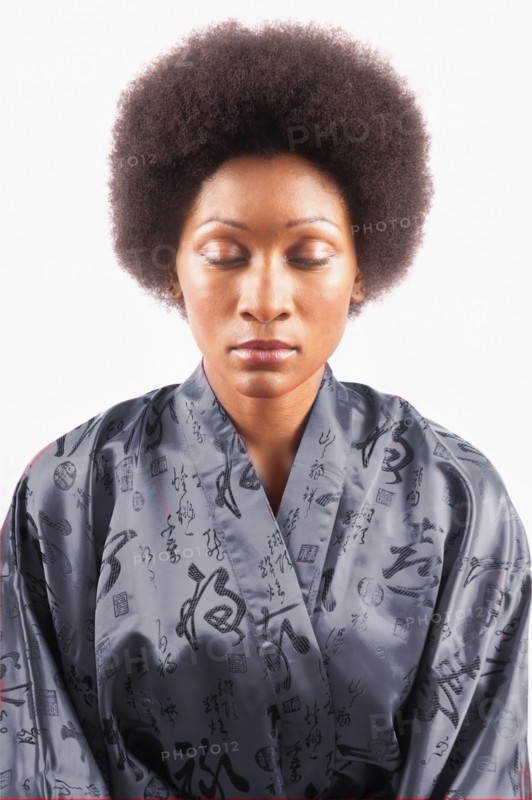 Studio portrait of woman with eyes closed