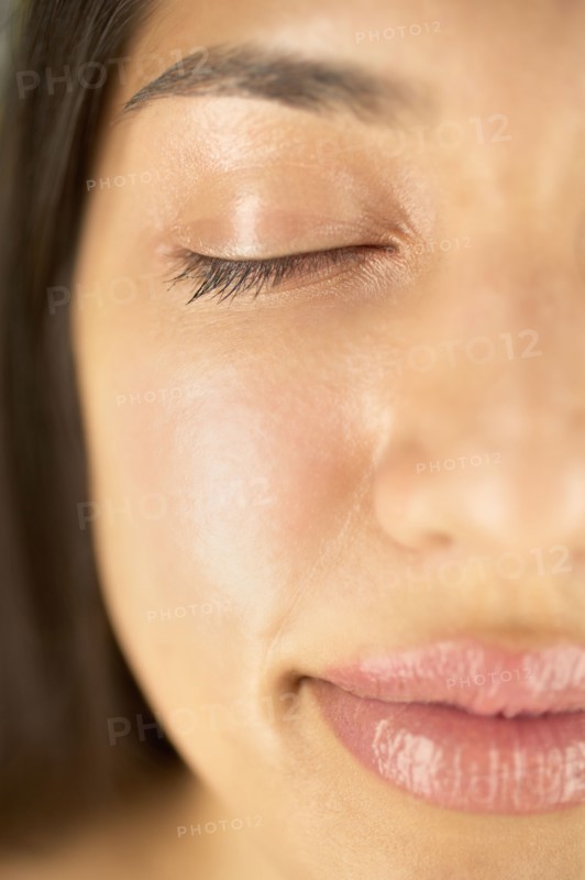 Close-up of woman with eyes closed