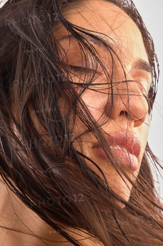 Close-up of woman with brown long hair