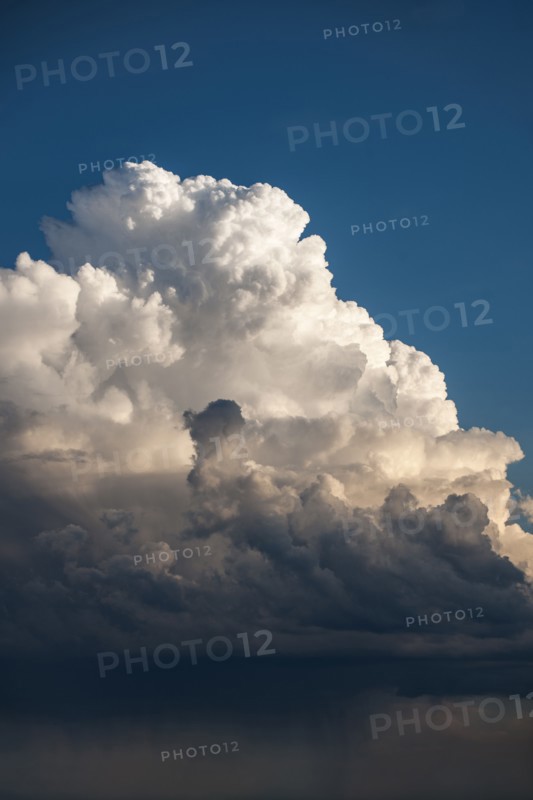 Cumulus storm clouds and rain