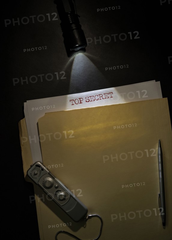 Overhead view of top secret documents on desk top