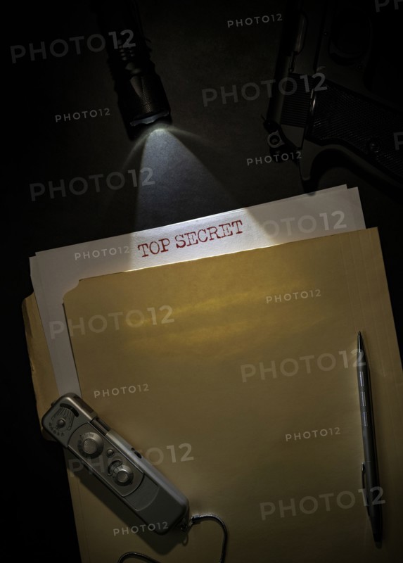 Overhead view of top secret documents on desk top