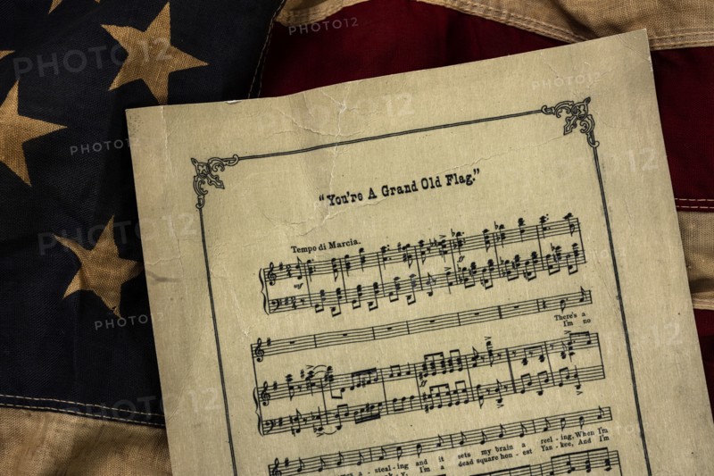 Vintage musical score Youre a Grand Old Flag and American flag