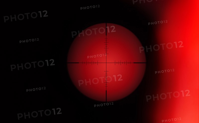 Rifle target crosshair against red background
