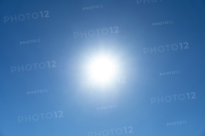 Bright sunburst in blue sky