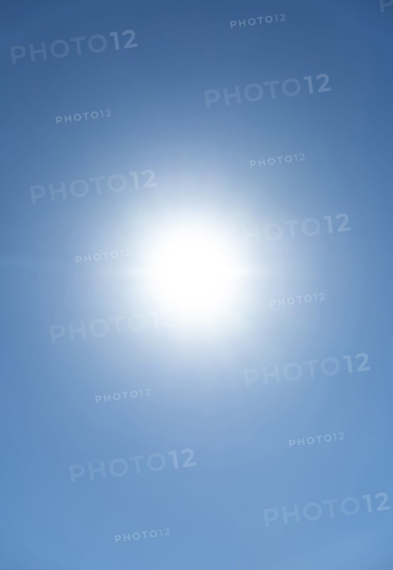 Bright sunburst in blue sky