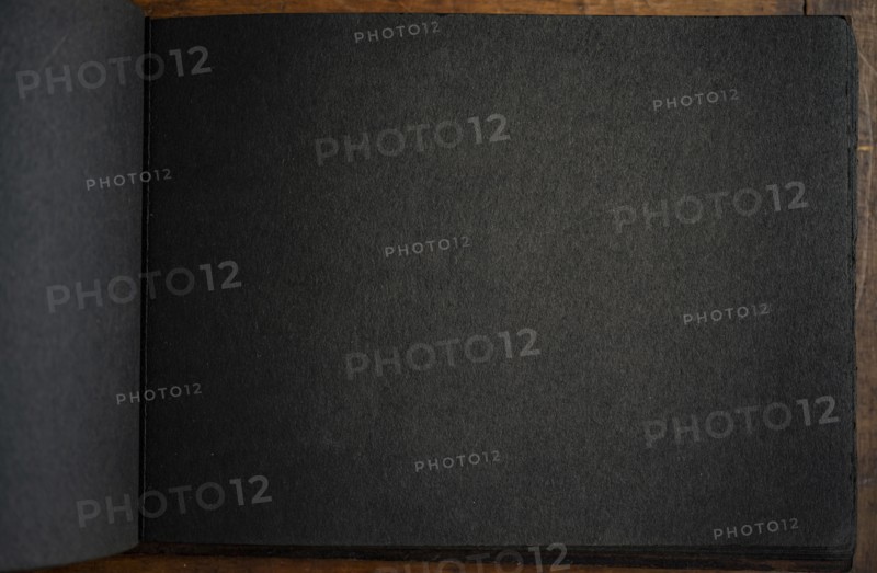Close-up of black paper in photo album